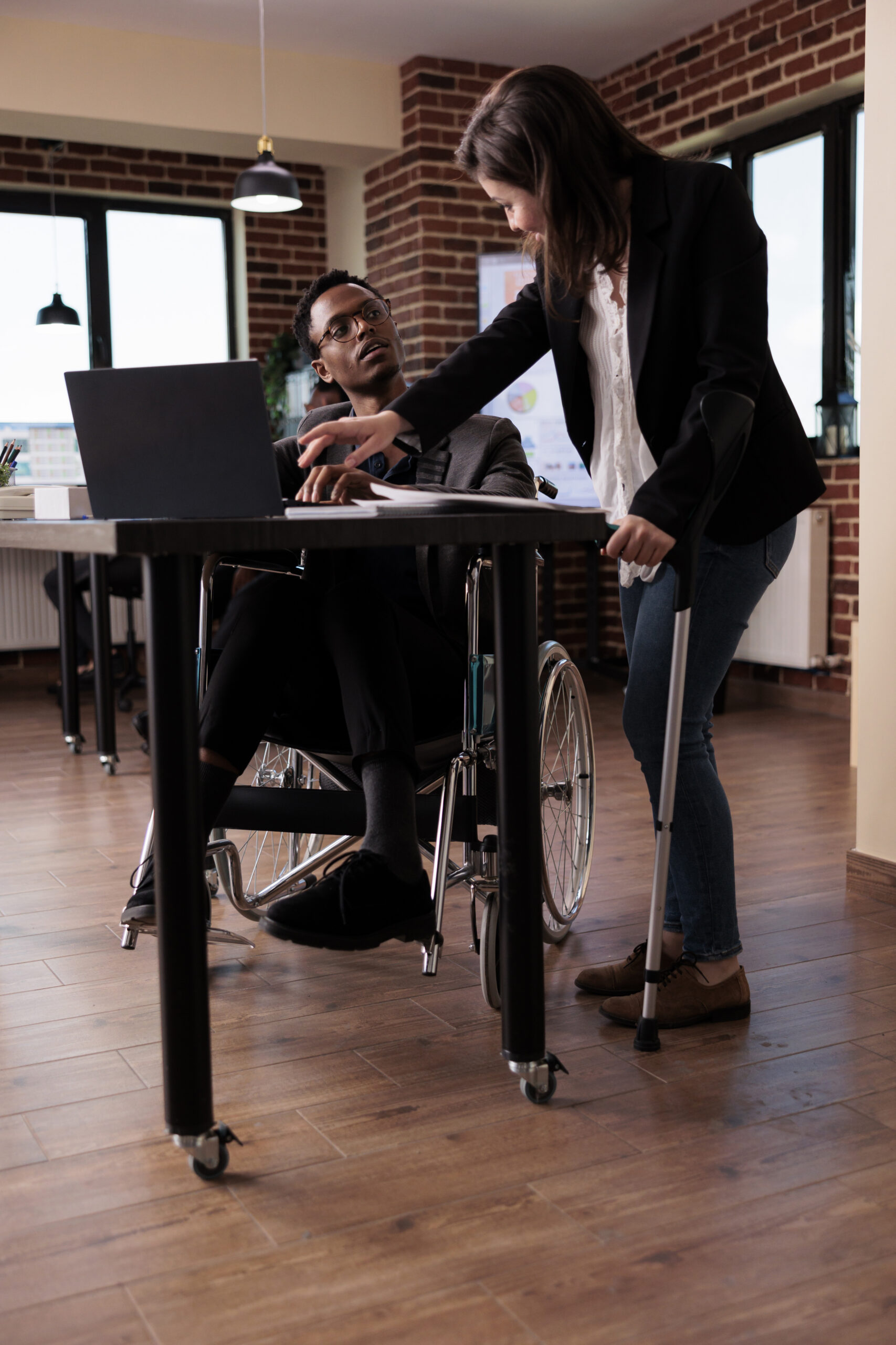 Multiethnic team of businesspeople with chronic impairment